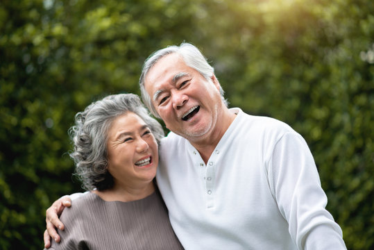 Smiling Asian elderly couple representing the wisdom and experience of long-term civic engagement